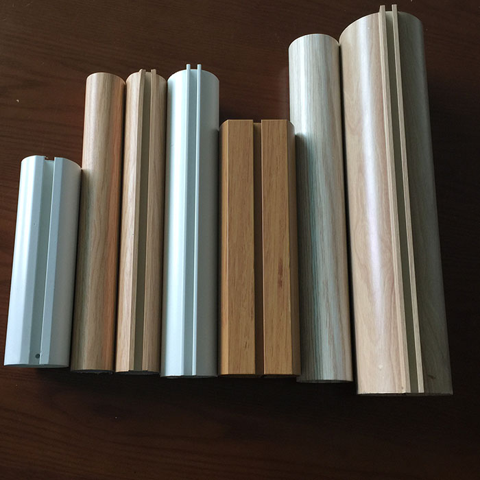Silver, white and wood-grain architectural aluminum section samples