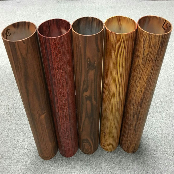 Five hollow round aluminum tubes with different wood-grain appearances
