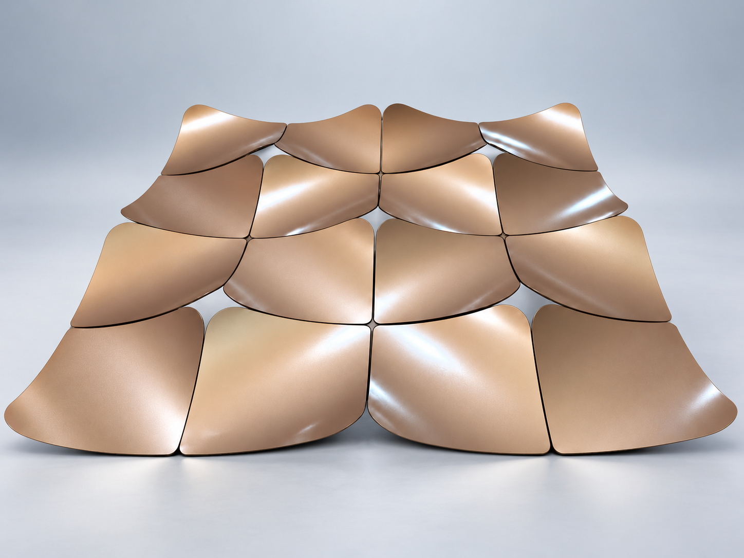 Bronze curved aluminum panel array on a light blue-gray studio background