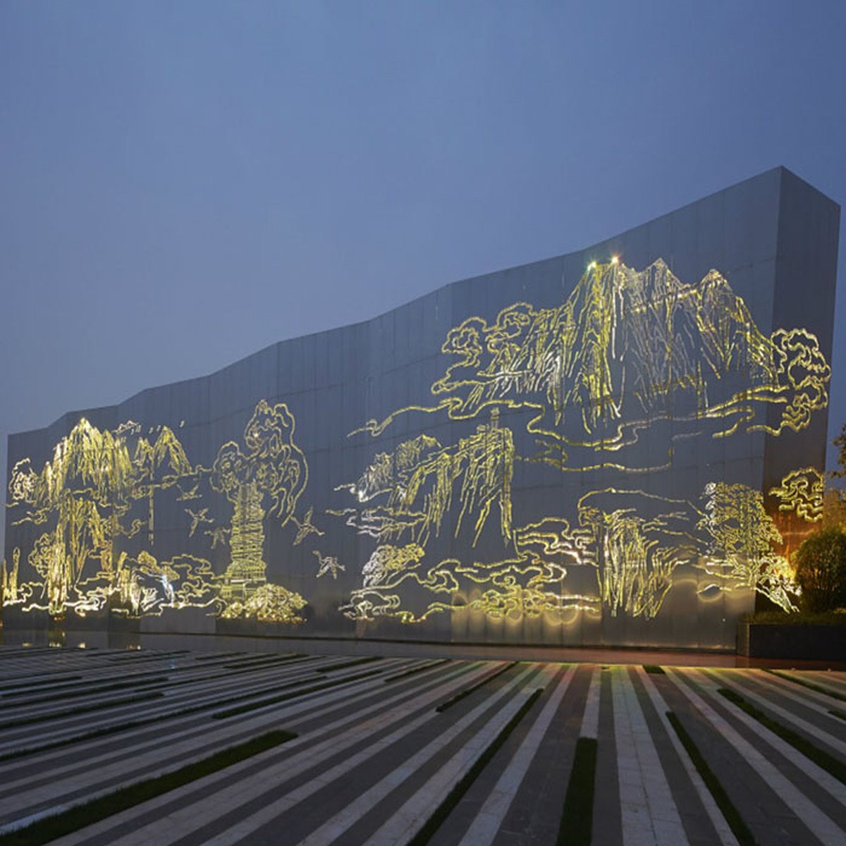 Decorative facade screen with an illuminated landscape motif