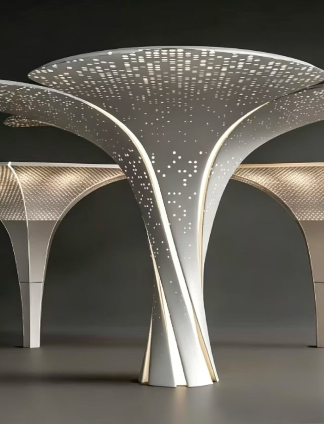 Design reference showing illuminated perforated tree-form column and canopy features against a dark background