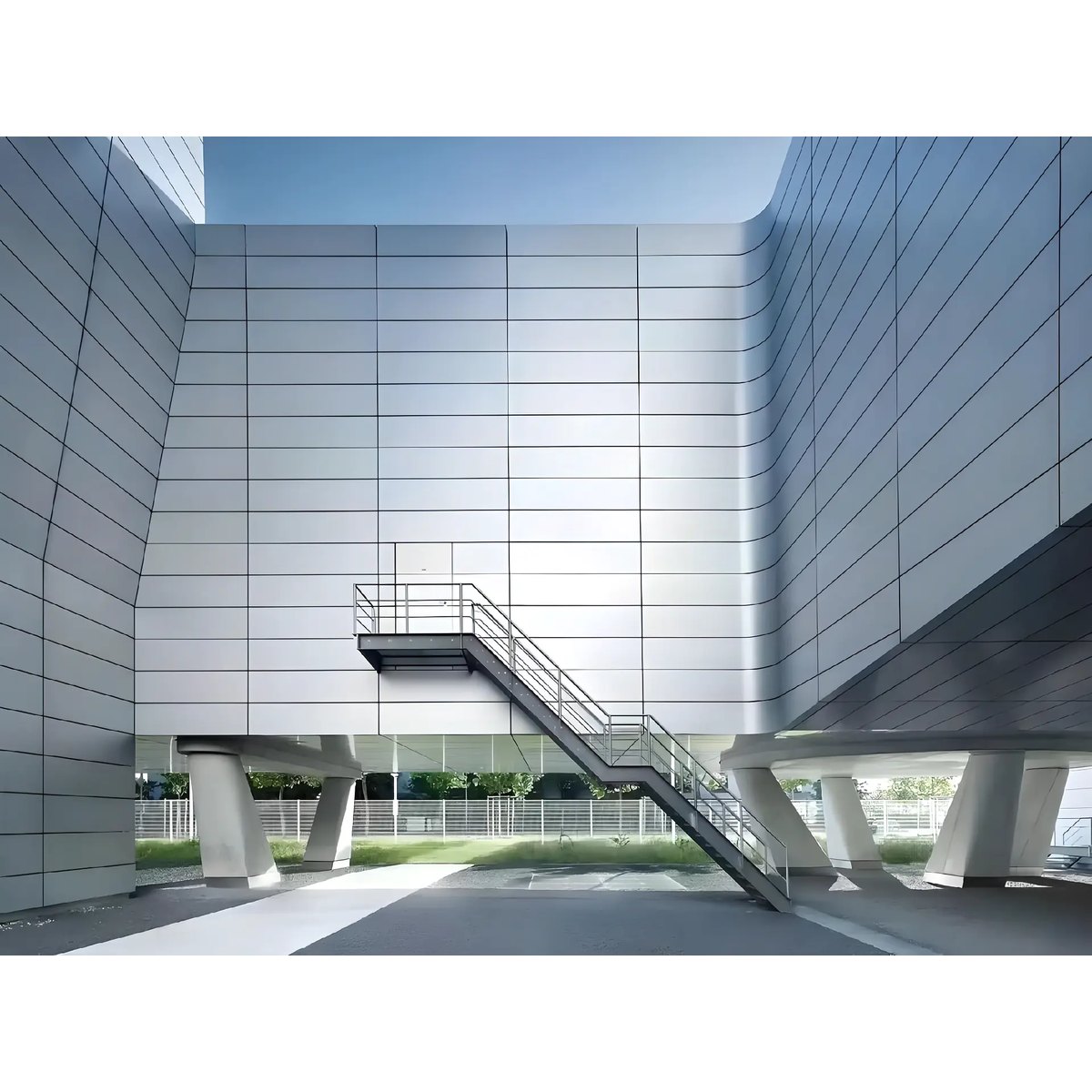 Exterior wall cladding with aligned rectangular panel joints beside a stair