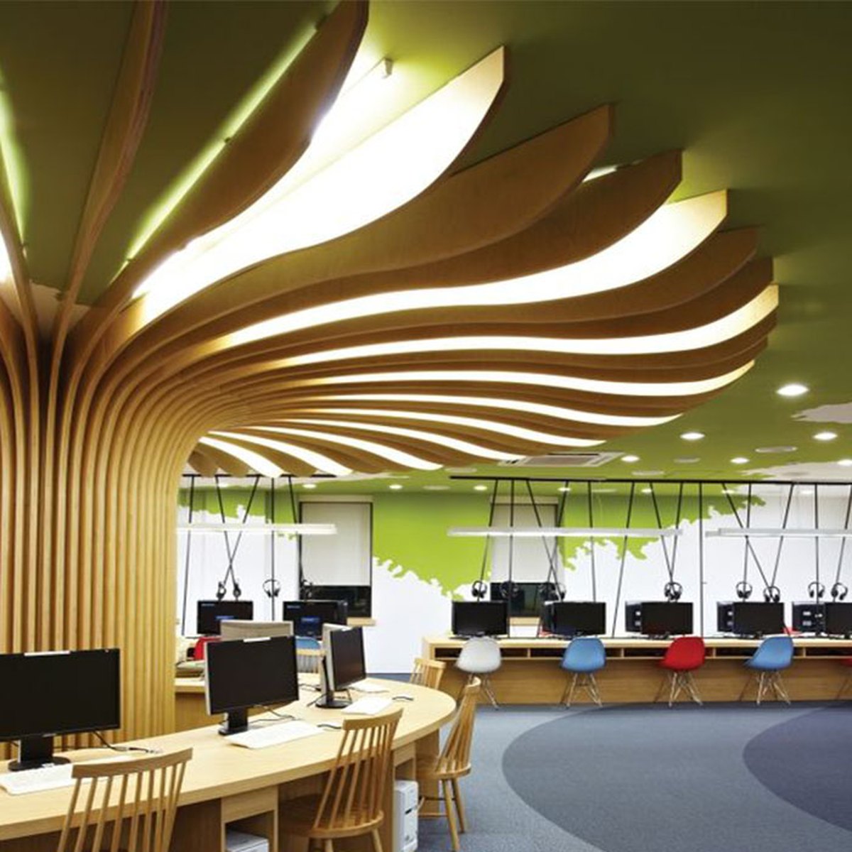 Flowing golden ceiling forms spreading from a central column above an office interior